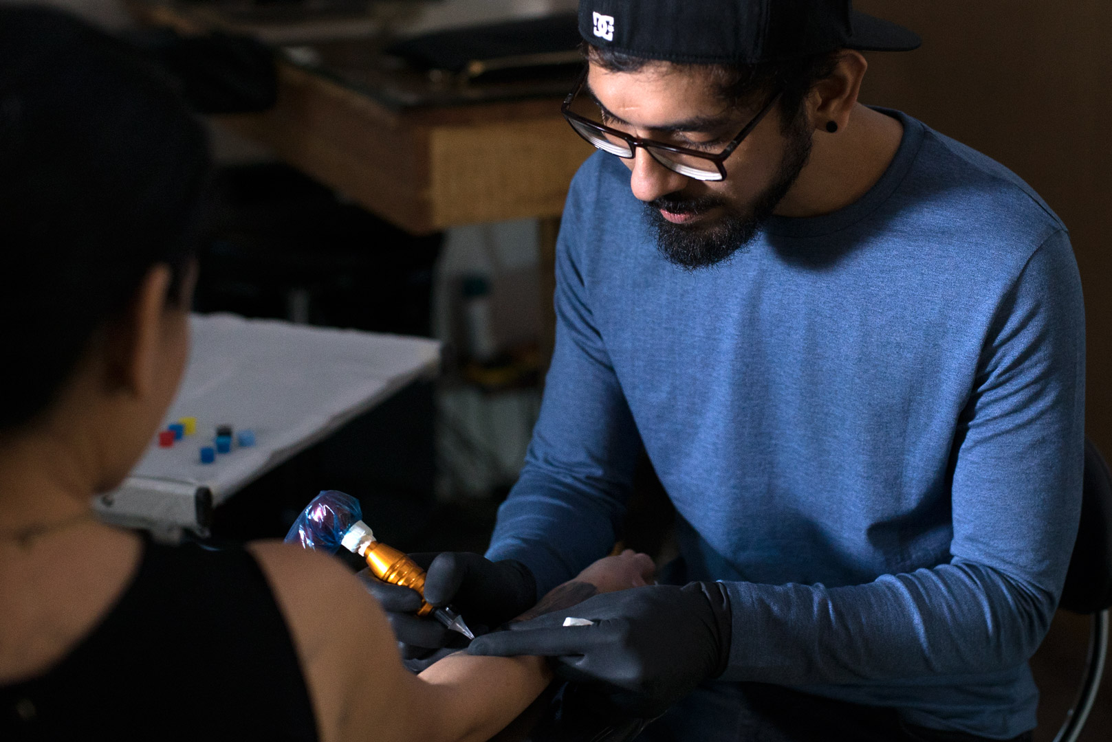 Eric working on a tattoo at his studio in Bandra.