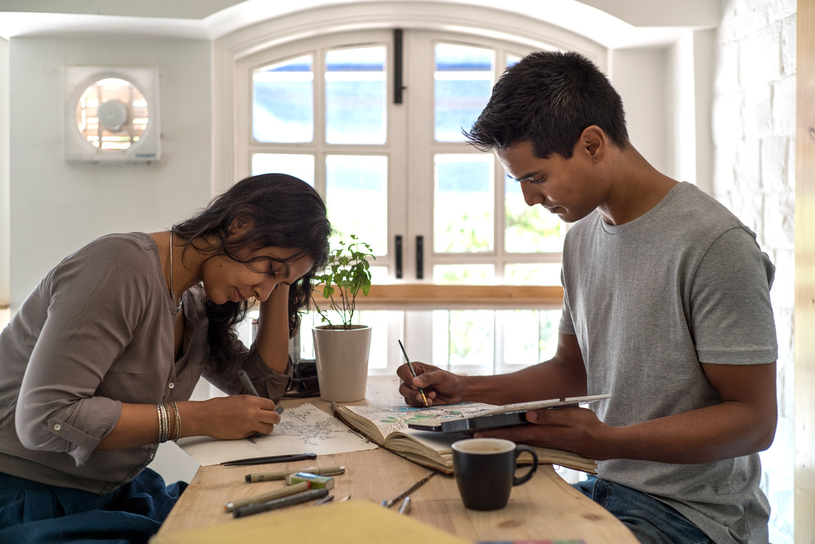 Ishaan and Ayeshe working on their illustrations.